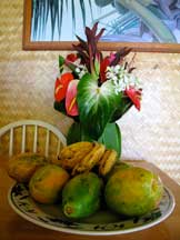 Table with anthurium and papaya